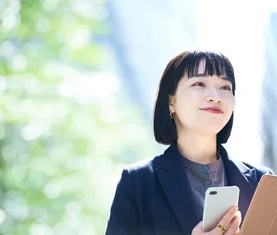 a woman holding a smartphone