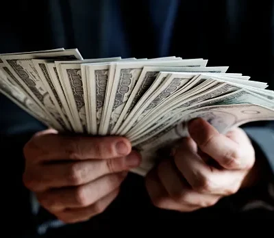 closeup of hands holding cash